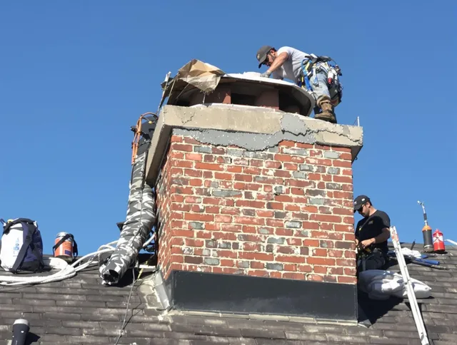 Wadsworth Chimney Sweep installing a custom chimney crown in Wadsworth, OH